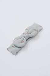 Avauma Lovely Bloom Headband in Mint Rose, with light gray ribbed fabric and delicate pink floral embroidery, tied in a bow